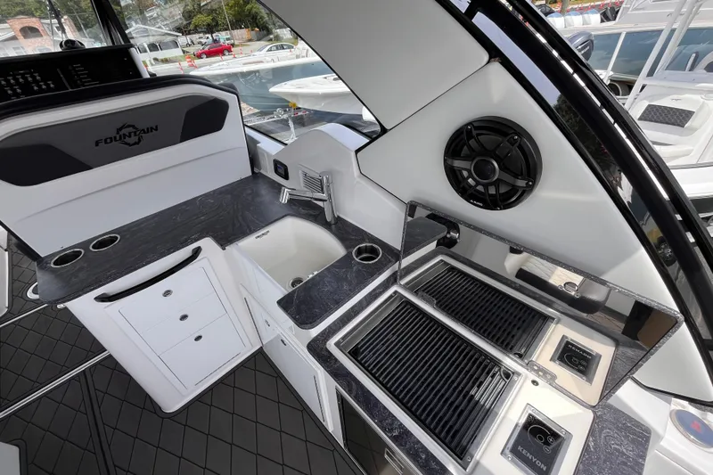 Slide: The Image of Luxurious 2025 Fountain 39 DX boat interior with sleek kitchen and modern amenities. - 16