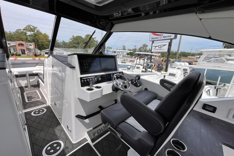 Slide: The Image of Interior of 2025 Fountain 39 DX boat with modern helm and seating. - 18