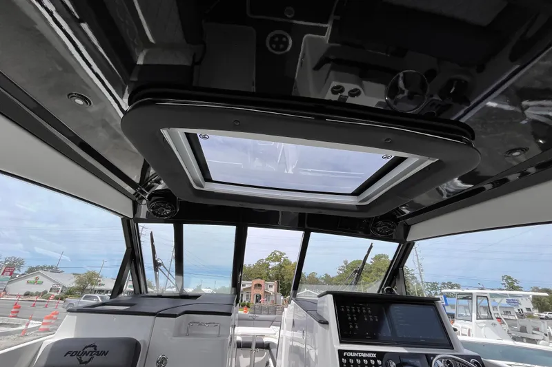 Slide: The Image of 2025 Fountain 39 DX boat interior with sunroof and advanced navigation system. - 19