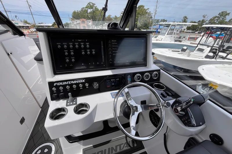Slide: The Image of 2025 Fountain 39 DX boat cockpit with advanced controls and navigation screens. - 21