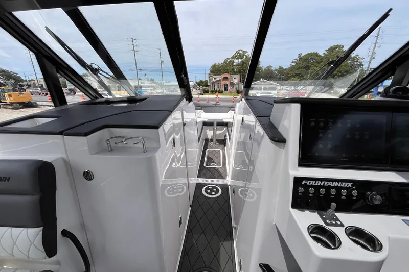 Slide: The Image of Interior view of 2025 Fountain 39 DX boat cockpit with modern controls and sleek design. - 23
