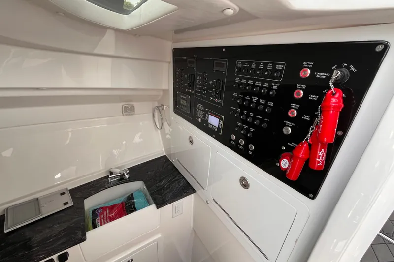 Slide: The Image of Control panel and sink area inside 2025 Fountain 39 DX boat cabin. - 26