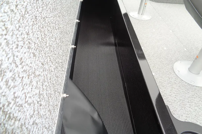 Slide: The Image of Interior view of 2026 Lund 1800 Explorer SS boat, showcasing sleek design and textured flooring. - 14