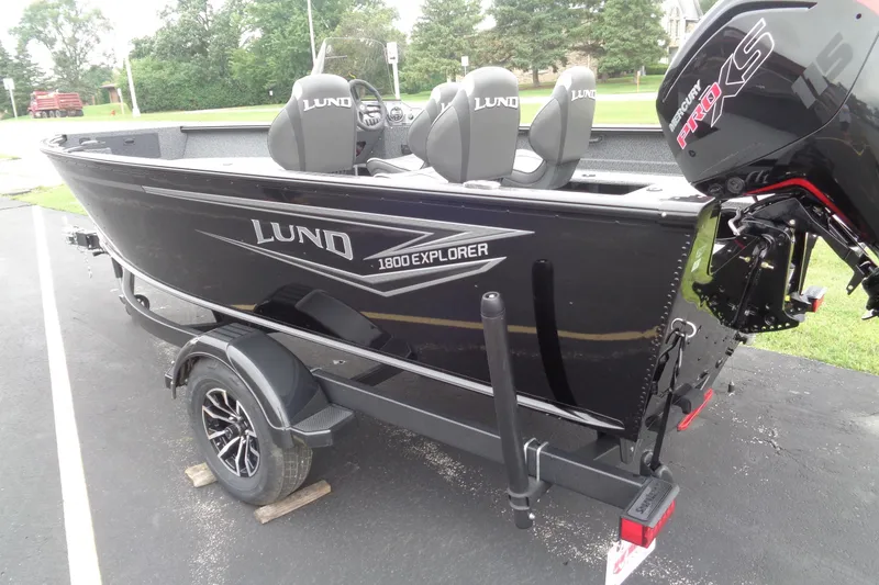 Slide: The Image of 2026 Lund 1800 Explorer SS boat with Mercury Pro XS engine on trailer. - 8
