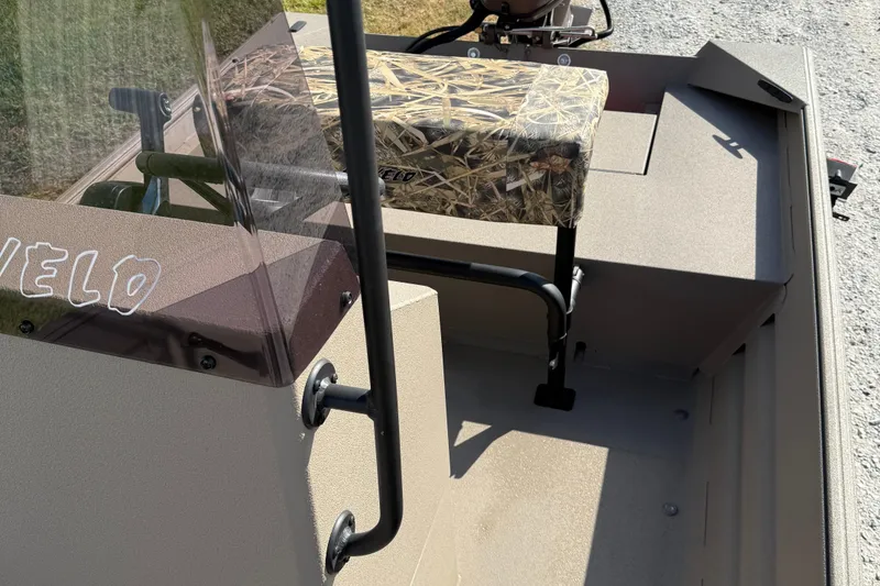 Slide: The Image of 2025 Alweld 1756 V MARSH C.C. boat interior with camouflage seat and steering console. - 10