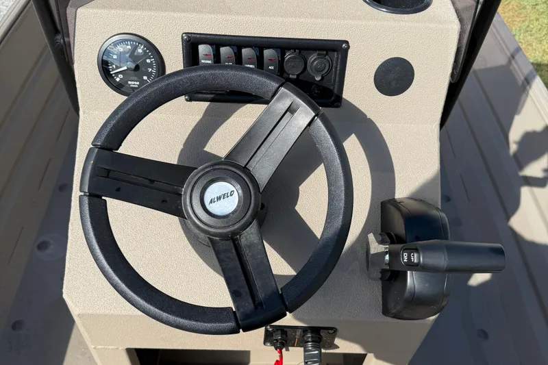 Slide: The Image of 2025 Alweld 1756 V MARSH C.C. boat steering console with controls and gauges. - 14