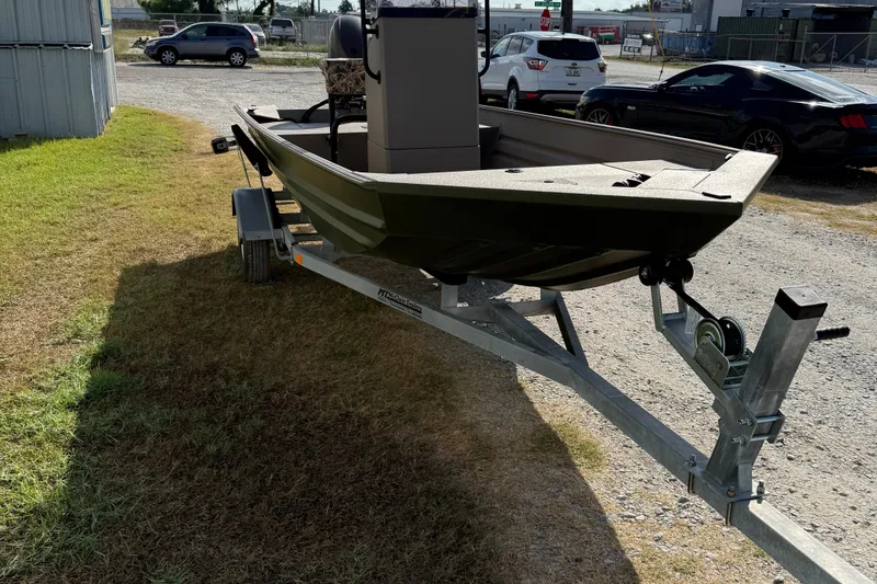 Slide: The Image of 2025 Alweld 1756 V MARSH C.C. boat on trailer, parked outdoors. - 5