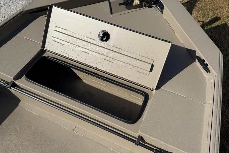 Slide: The Image of 2025 Alweld 1756 V MARSH C.C. boat storage compartment, open lid, beige color. - 7