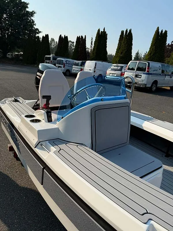 Slide: The Image of Aspen Carbon Cat T13C 2026 with white seats outdoors. - 3