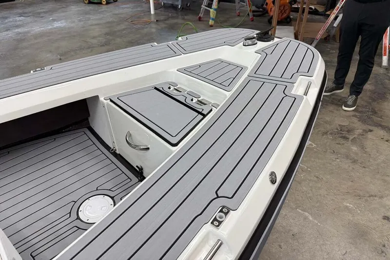 Slide: The Image of Aspen Carbon Cat T13C 2026 on a boat trailer outdoors. - 4