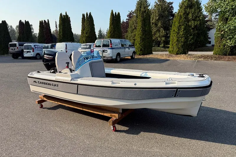 Slide: The Image of Aspen Carbon Cat T13C 2026 with Mercury 30 engine at dock. - 5