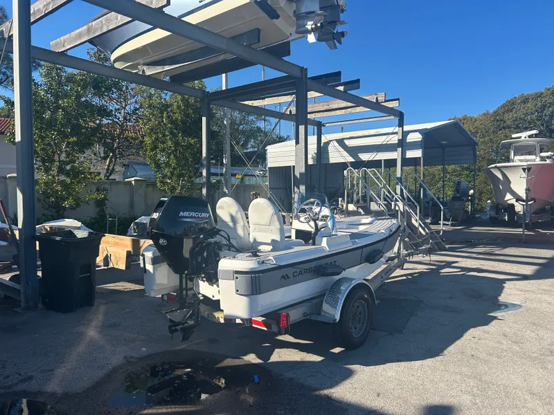 Slide: The Image of Aspen Carbon Cat T13C 2026 on a trailer outdoors. - 7