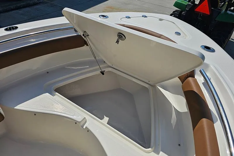 Slide: The Image of 2026 Pioneer 202 Islander boat storage compartment with open hatch, showcasing interior space. - 22