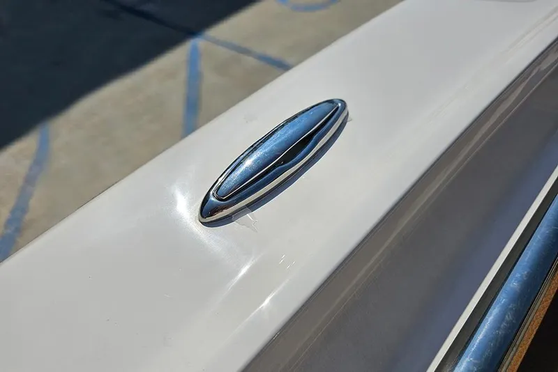 Slide: The Image of Close-up of a 2026 Pioneer 202 Islander boat's sleek chrome detail. - 23