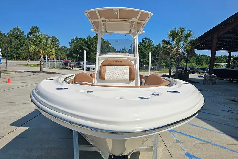 Slide: The Image of 2026 Pioneer 202 Islander boat displayed outdoors, featuring sleek design and comfortable seating. - 6