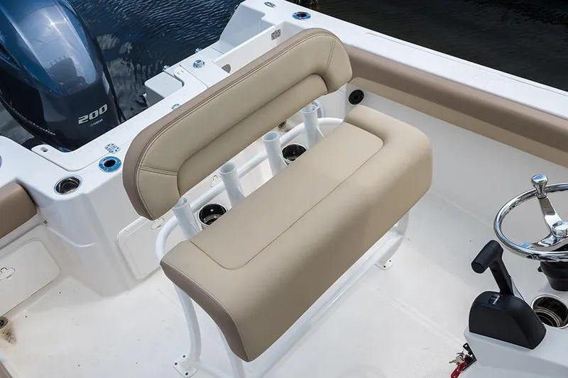 Slide: The Image of Manufacturer Provided Image: 2022 Sailfish 220 CC boat seating and helm area with beige cushions. - 10