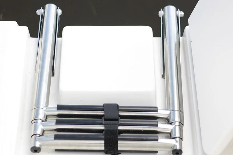 Slide: The Image of Manufacturer Provided Image: Foldable ladder on a 2022 Sailfish 220 CC boat. - 14