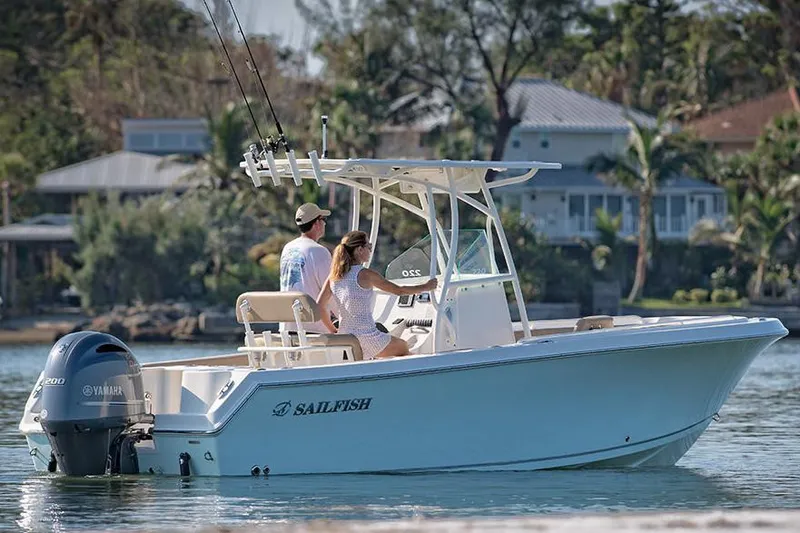 Slide: The Image of Manufacturer Provided Image: 2022 Sailfish 220 CC boat cruising near shore with two people onboard. - 3