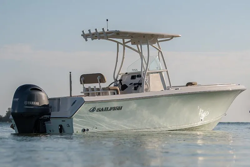 Slide: The Image of Manufacturer Provided Image: 2022 Sailfish 220 CC boat on calm water with Yamaha outboard motor. - 4