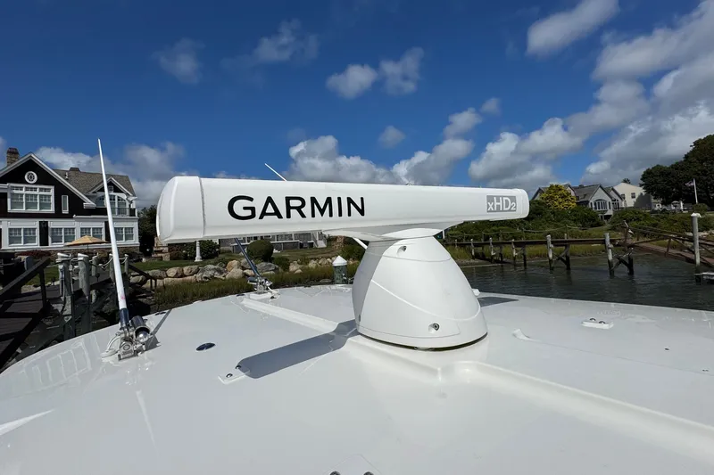 Slide: The Image of Garmin xHD2 radar on 2023 Regulator 34 Center Console boat, docked near waterfront homes. - 30
