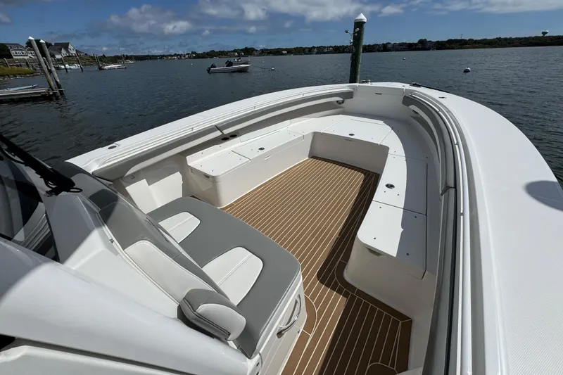 Slide: The Image of 2023 Regulator 34 Center Console boat with spacious seating and scenic water view. - 33