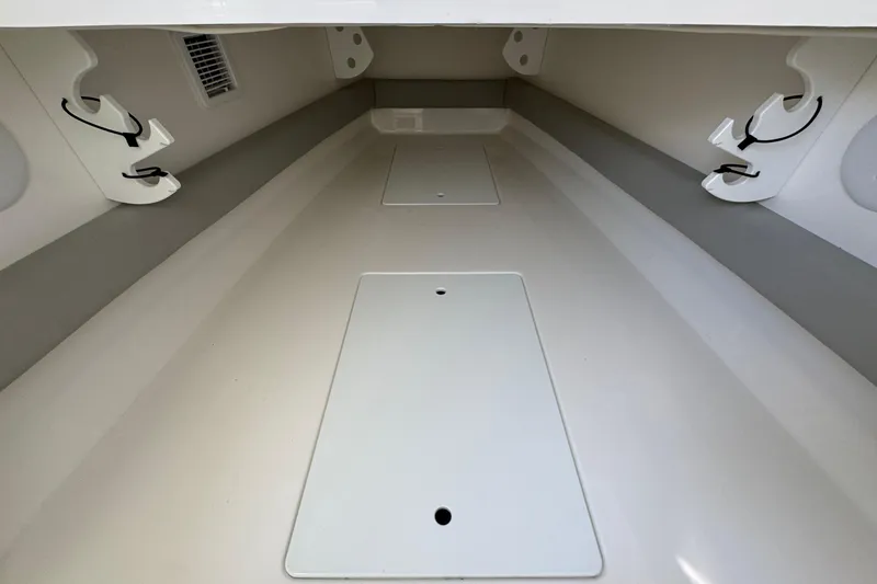 Slide: The Image of 2023 Regulator 34 Center Console interior storage compartment, featuring sleek design and utility. - 35