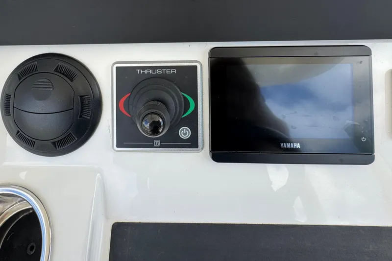 Slide: The Image of Control panel of 2023 Regulator 34 Center Console with thruster and Yamaha display. - 47