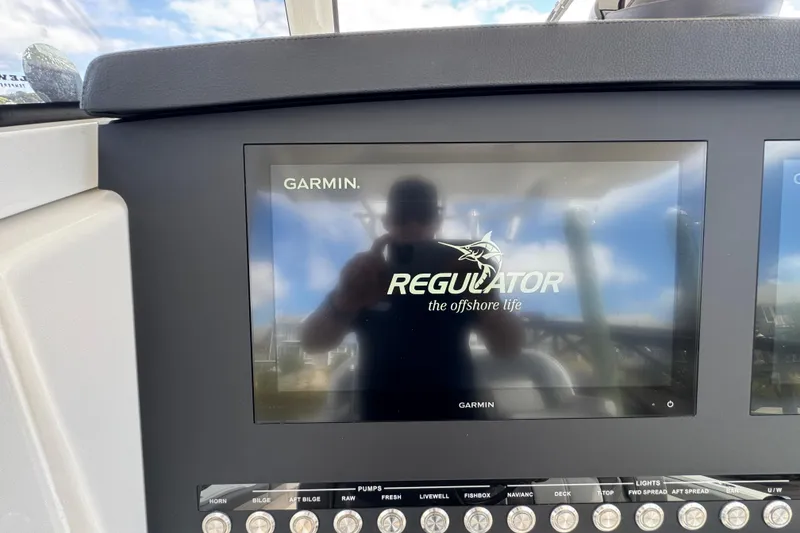 Slide: The Image of Garmin display on 2023 Regulator 34 Center Console boat dashboard. - 50