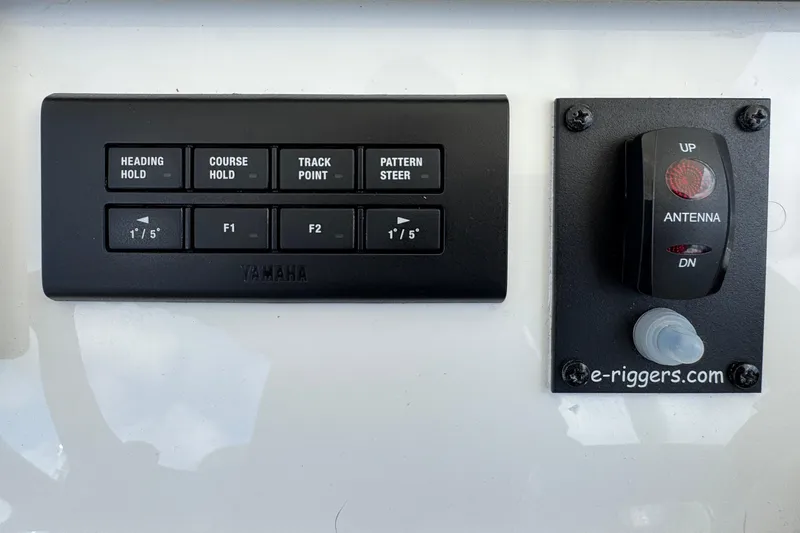 Slide: The Image of Control panel of 2023 Regulator 34 Center Console with Yamaha navigation buttons. - 51