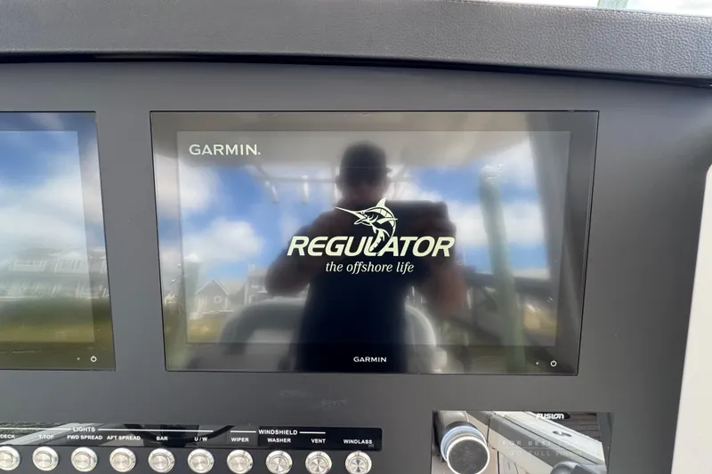 Slide: The Image of Garmin display on 2023 Regulator 34 Center Console boat dashboard. - 52