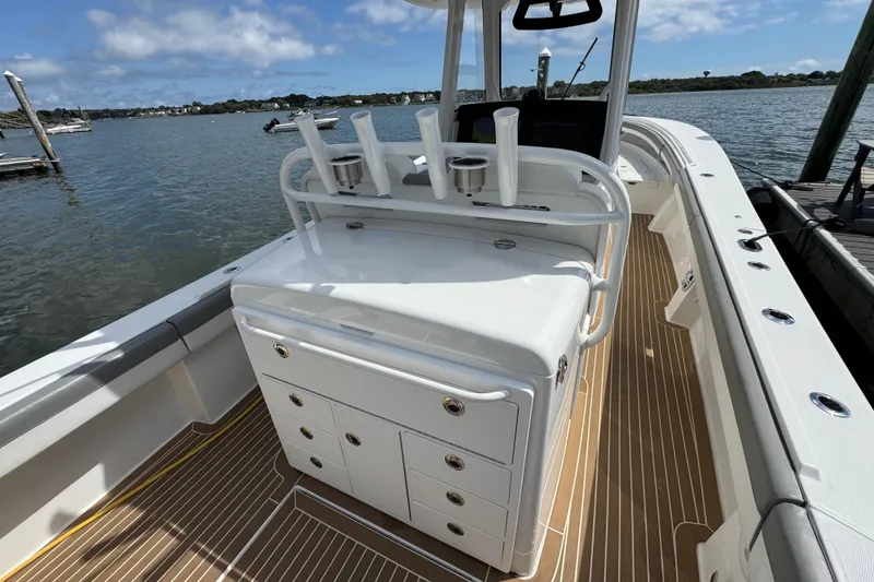 Slide: The Image of 2023 Regulator 34 Center Console boat with sleek deck and storage compartments. - 62