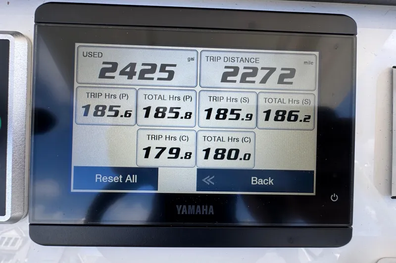 Slide: The Image of Yamaha display showing fuel usage and trip data on 2023 Regulator 34 Center Console. - 81