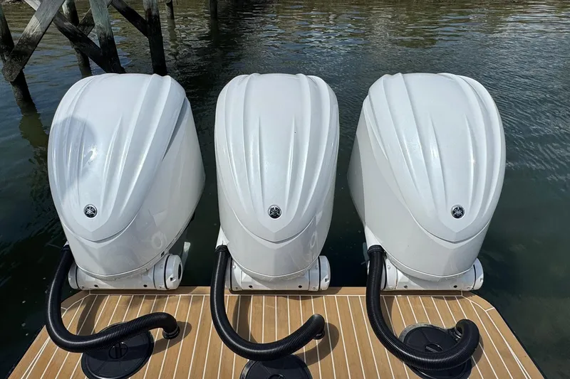Slide: The Image of Triple outboard engines on a 2023 Regulator 34 Center Console boat. - 82