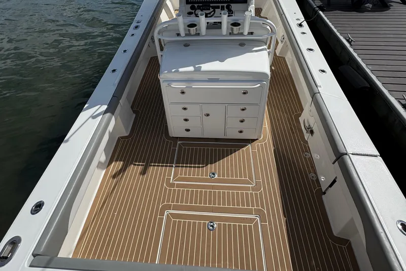 Slide: The Image of 2023 Regulator 34 Center Console boat interior with sleek deck and storage compartments. - 92