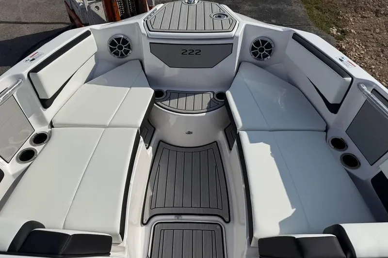 Slide: The Image of 2026 Yamaha Boats 222S interior with white seating and cup holders. - 10