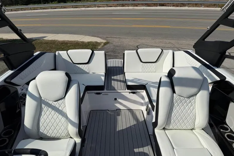Slide: The Image of 2026 Yamaha Boats 222S interior with white quilted seating and modern design. - 12