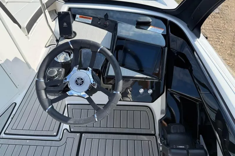 Slide: The Image of 2026 Yamaha Boats 222S dashboard with steering wheel and control panel. - 9