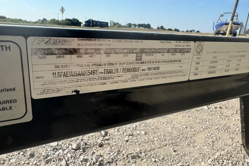 Slide: The Image of Label on a Skeeter ZX200 trailer, showing specifications and VIN details. - 11