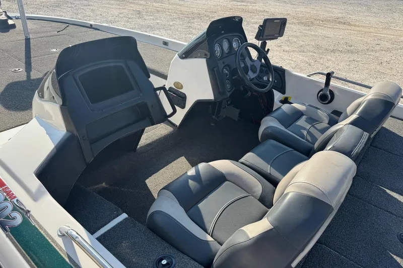 Slide: The Image of 2000 Skeeter ZX200 boat interior with dual seats and steering console. - 8