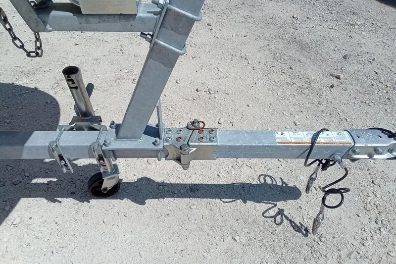 Slide: The Image of Trailer hitch for 1985 Boston Whaler 150 Sport on gravel surface. - 4