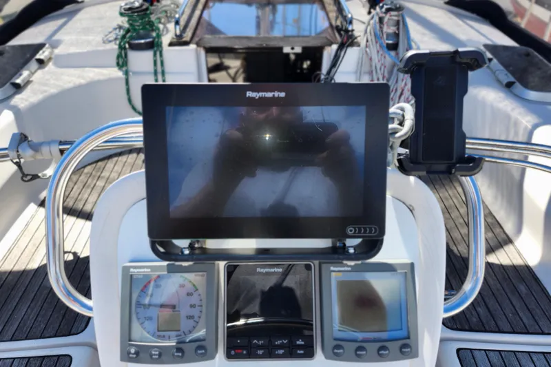 Slide: The Image of Cockpit of 2001 Bavaria 43 Cruiser with Raymarine navigation equipment. - 17