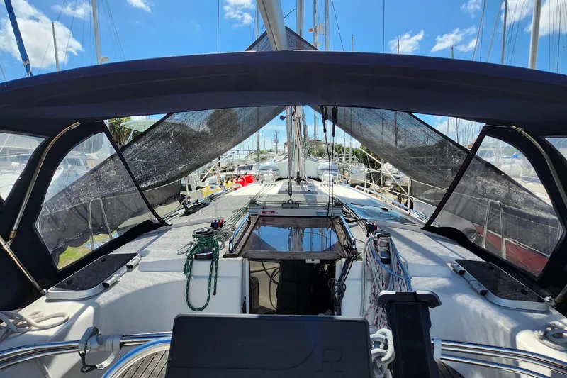 Slide: The Image of Cockpit view of a 2001 Bavaria 43 Cruiser sailboat, docked under a clear blue sky. - 19