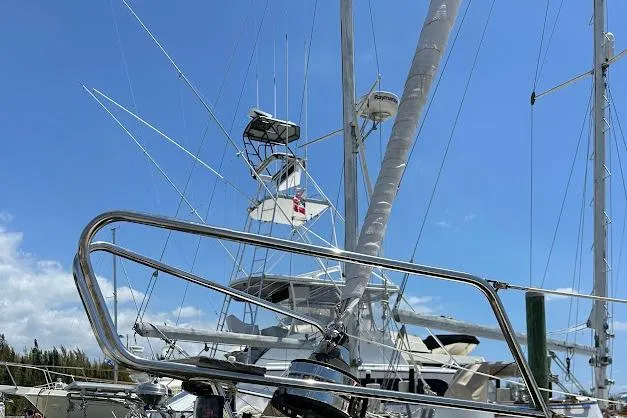 Slide: The Image of Sailboat Bavaria 42, 2001 model, with rigging against a clear blue sky. - 23