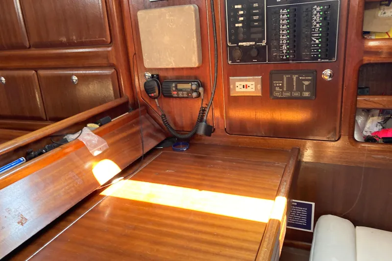 Slide: The Image of Interior of 2001 Bavaria 43 Cruiser sailboat with navigation equipment and wooden cabinetry. - 30