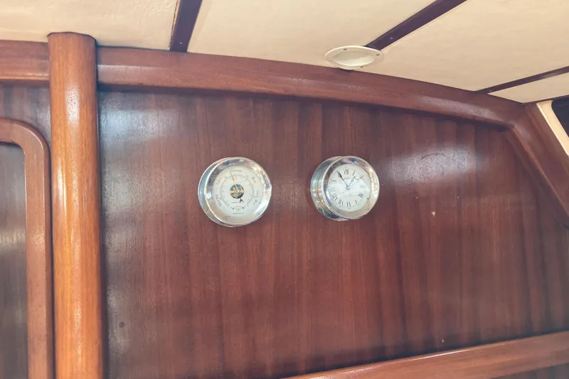 Slide: The Image of Wooden interior of 2001 Bavaria 43 Cruiser with barometer and clock. - 32