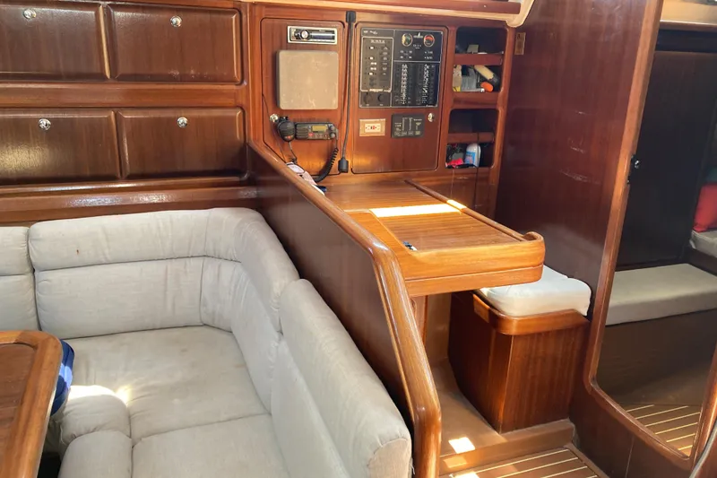 Slide: The Image of Interior of 2001 Bavaria 43 Cruiser yacht with wooden cabinetry and cushioned seating. - 35
