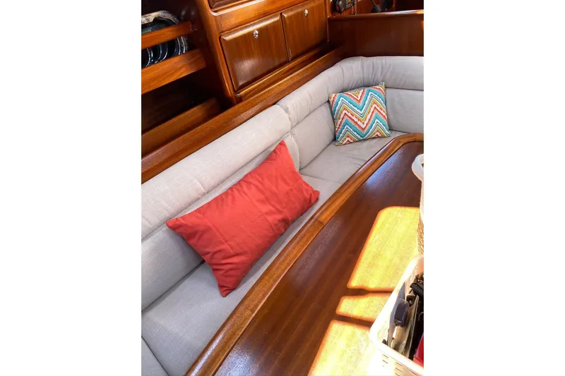 Slide: The Image of Interior of 2001 Bavaria 43 Cruiser with cozy seating and colorful cushions. - 39