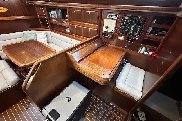 Slide: The Image of Interior of 2001 Bavaria 42 sailboat with wooden furnishings and navigation station. - 43