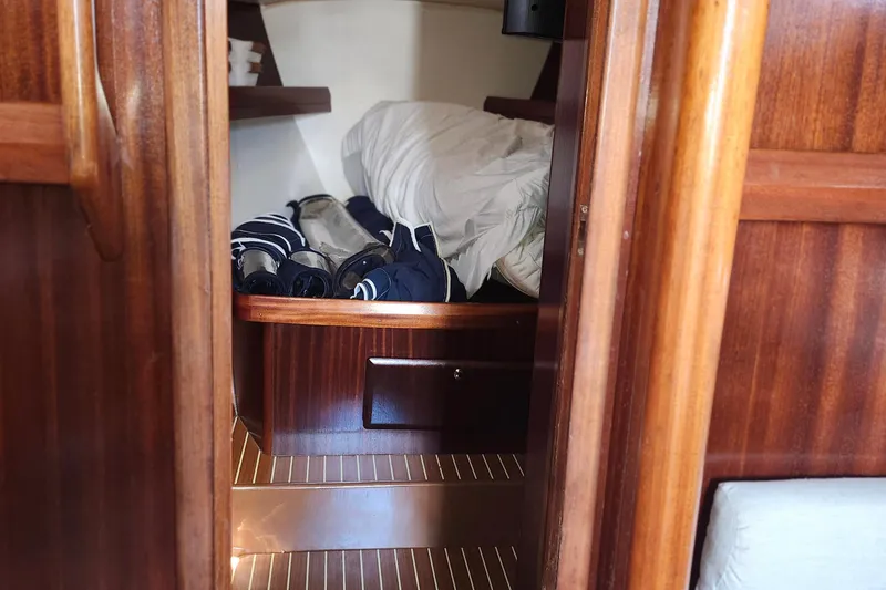Slide: The Image of Cozy cabin interior of 2001 Bavaria 43 Cruiser sailboat with wooden finish. - 56