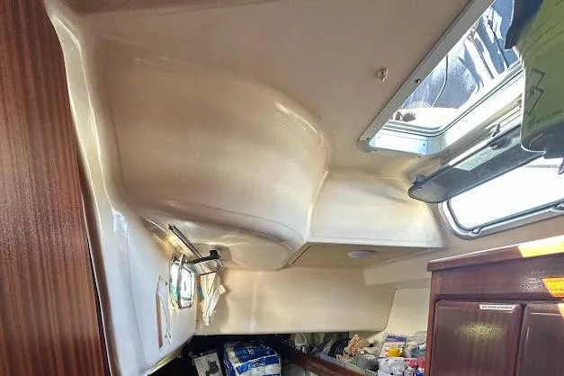 Slide: The Image of Interior cabin of a 2001 Bavaria 42 sailboat with storage and skylight. - 57
